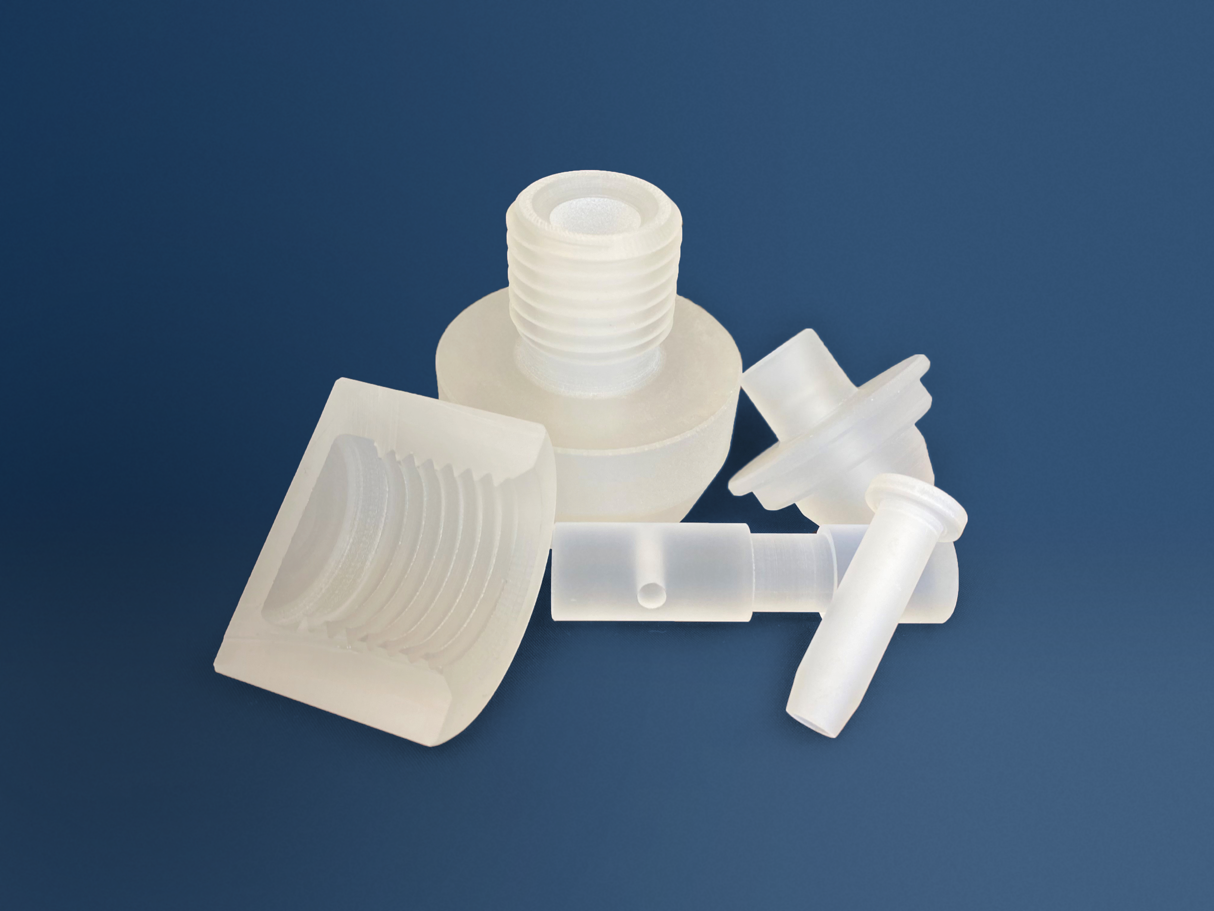 Various processed glass elements arranged on a blue background