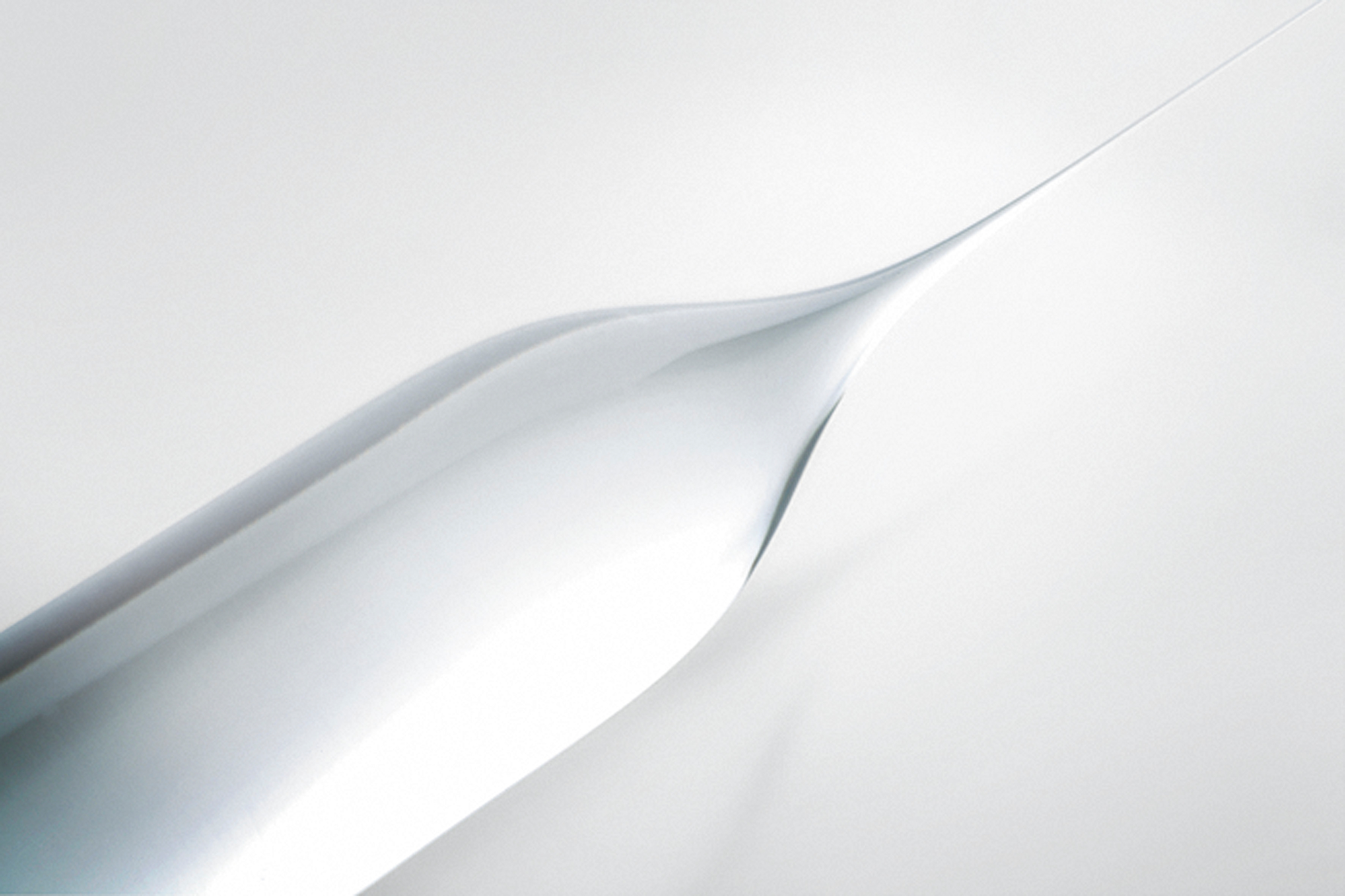 A photo of a fused silica preform tapering to a very fine point