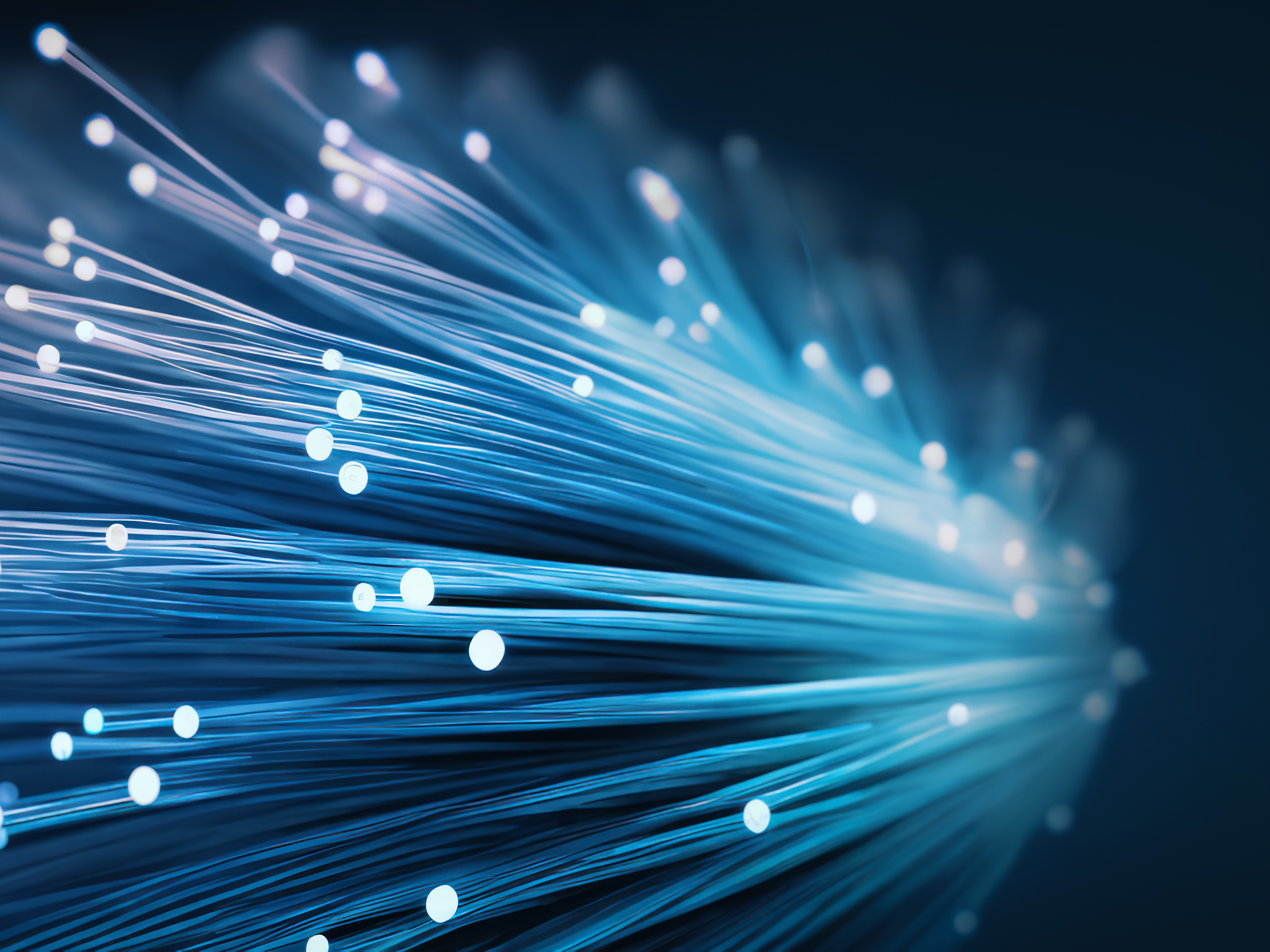 AI generated. A fiber optic bundle, with blue lighting effect onblack background